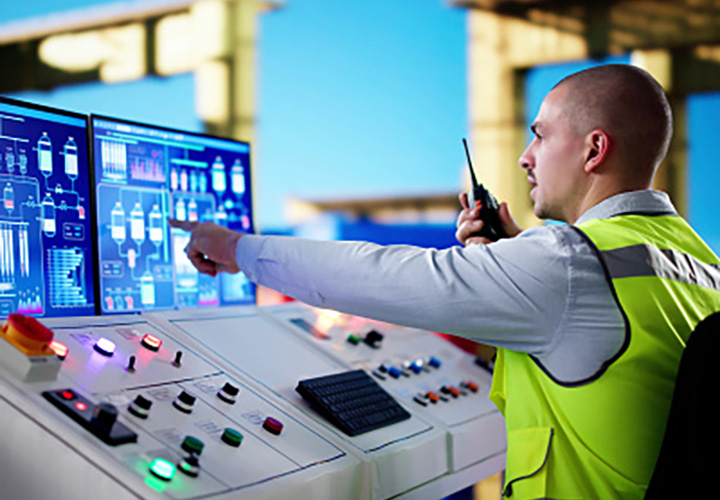 picture of a man monitoring a controlled system